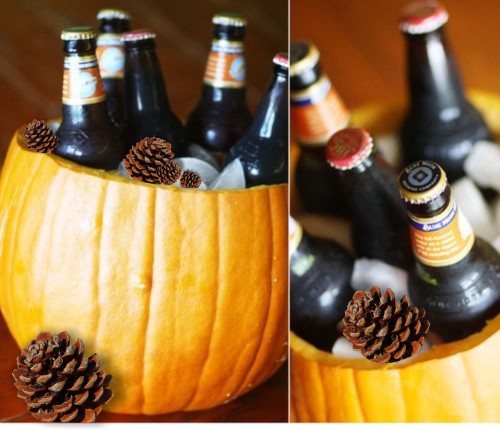 A hollowed-out pumpkin is used as an ice bucket for beer bottles.